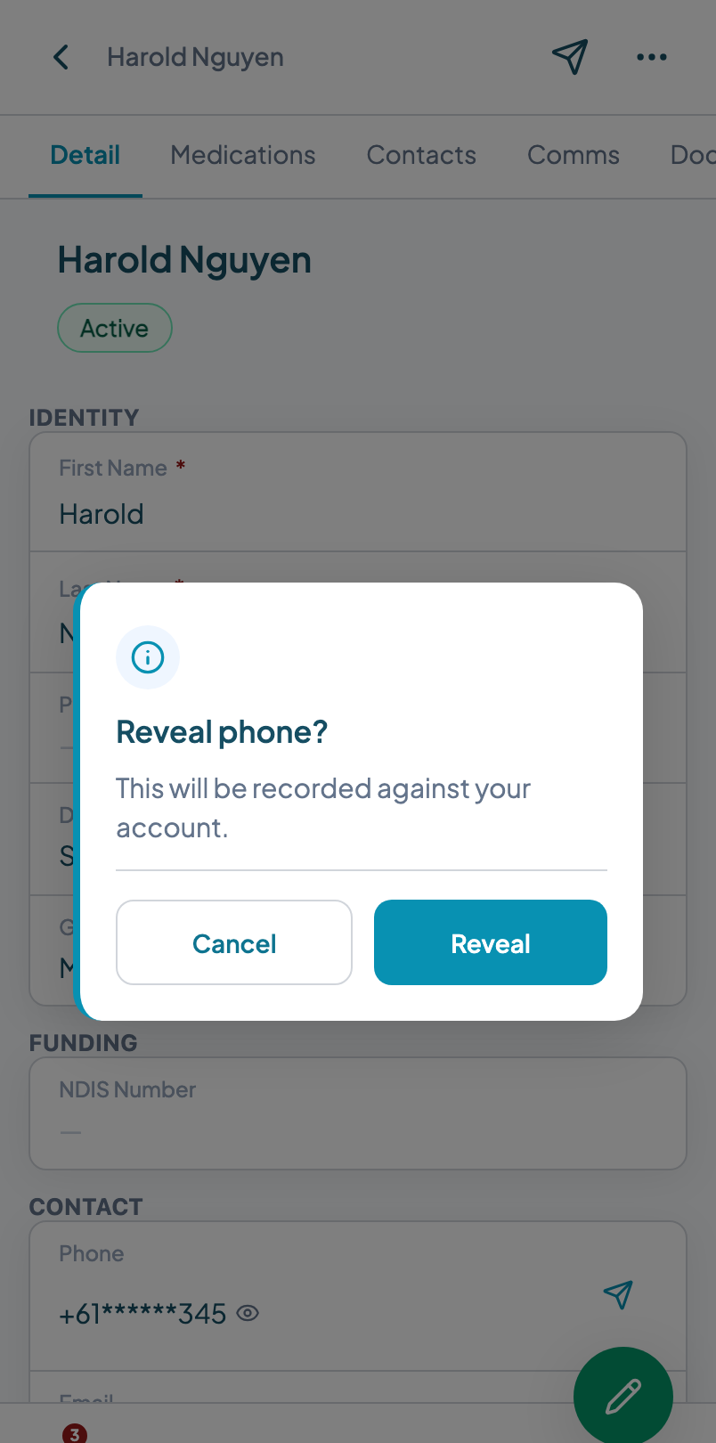 Client record phone field masked, with a reveal warning dialog open